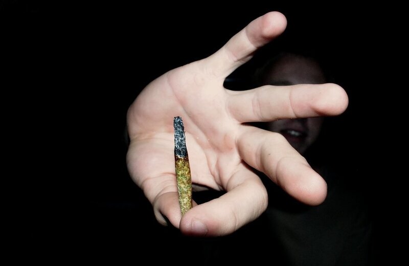 hand holding a cigarette