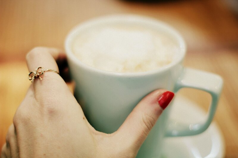 hand holding a coffee cup