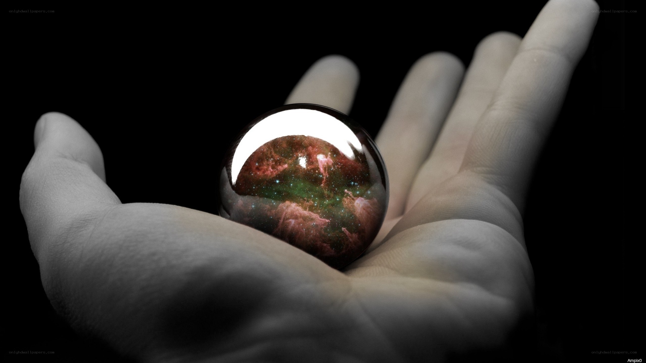 hand holding a crystal ball