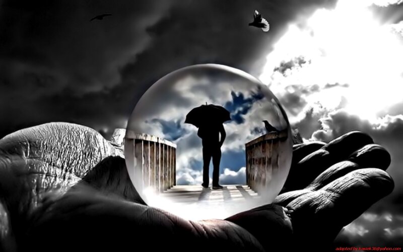Hand holding a crystal ball