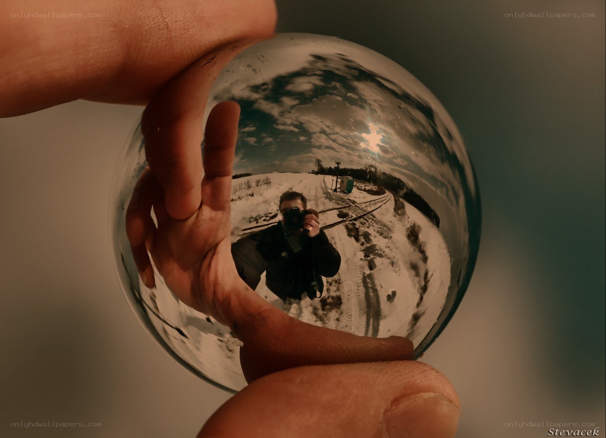 Hand holding a crystal ball