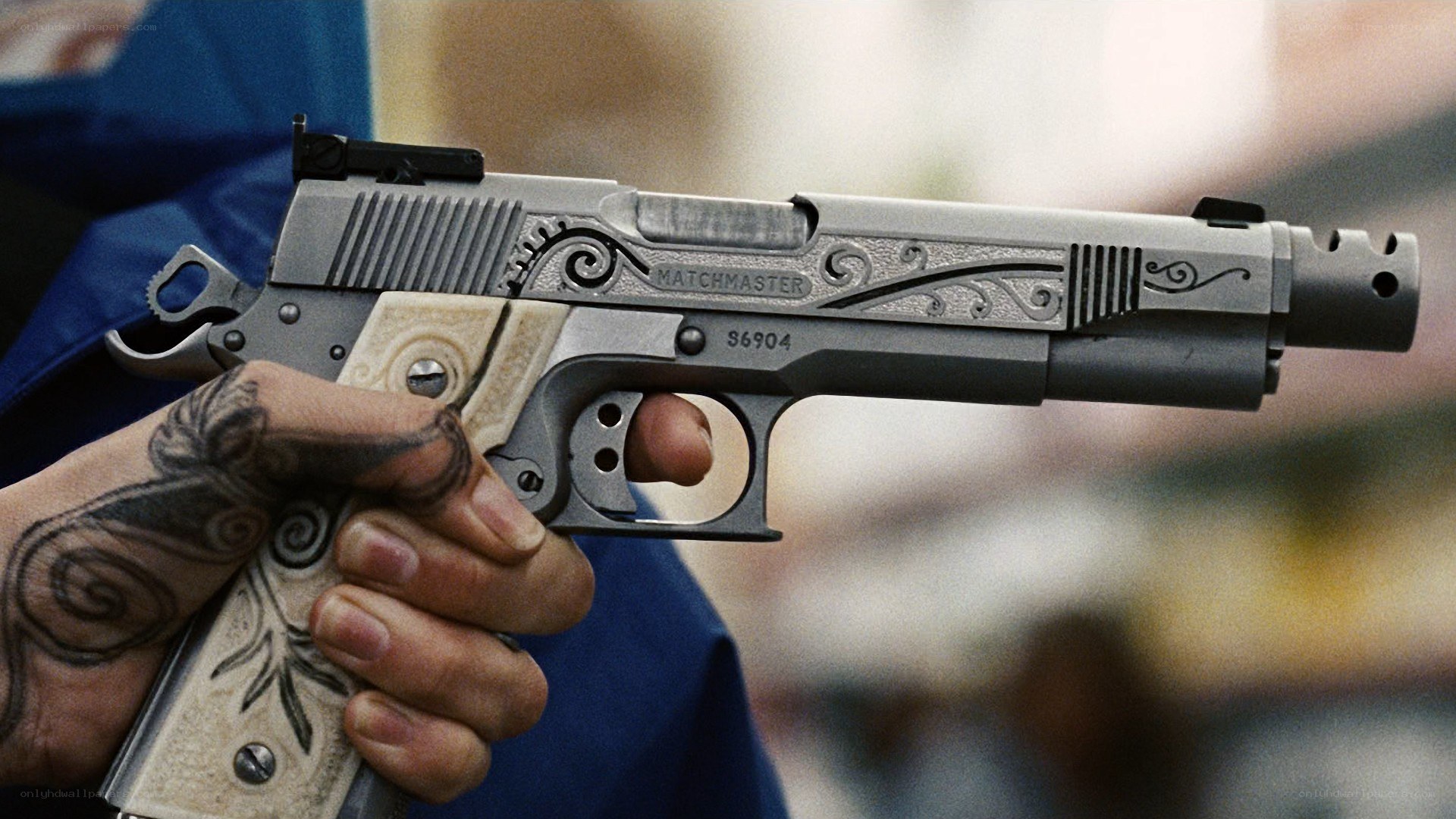 hand holding a custom pistol