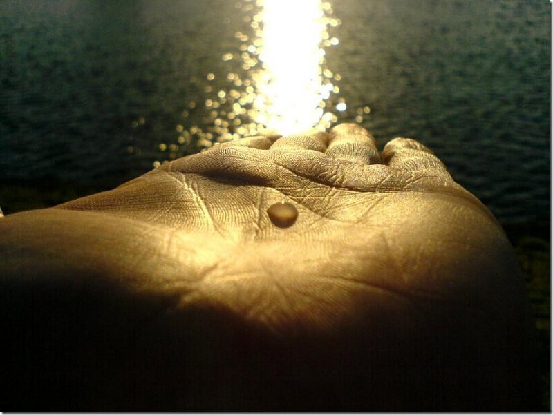 Hand Holding a Drop