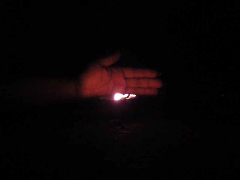 hand holding a flame