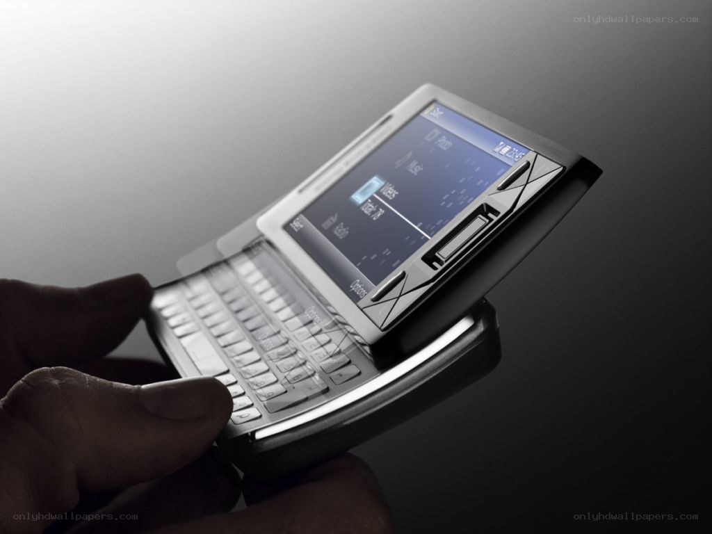 hand holding a flip phone