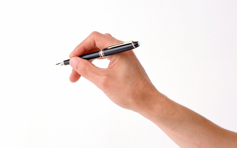 hand holding a fountain pen