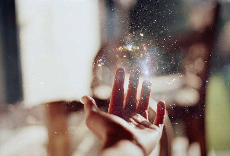 hand holding a galaxy