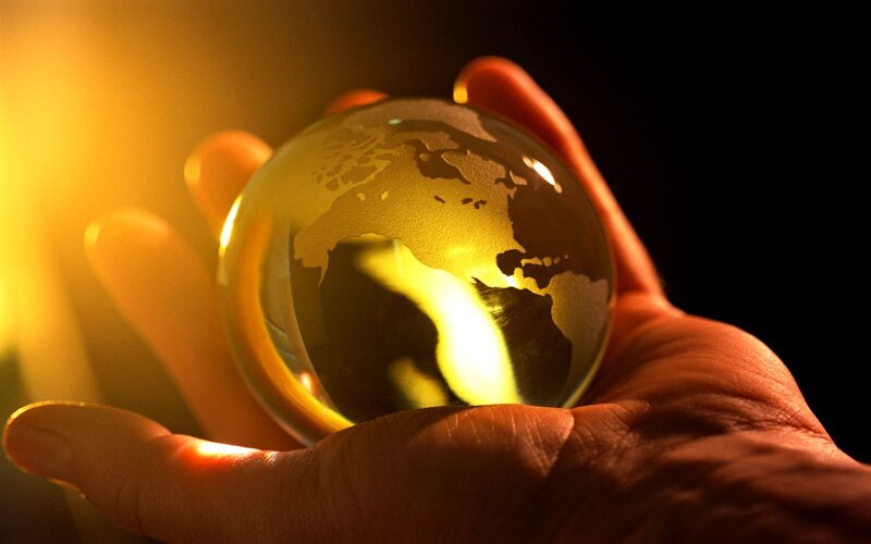hand holding a globe