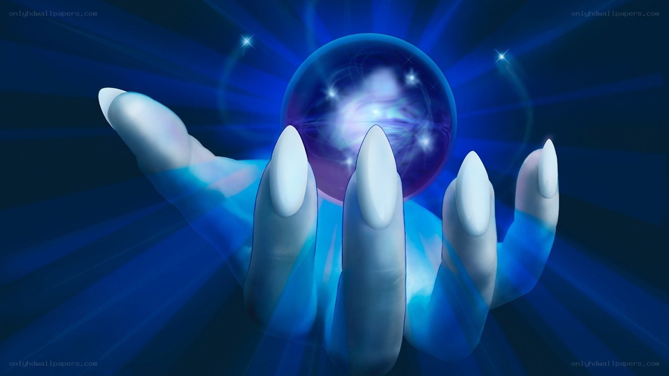 hand holding a glowing crystal ball