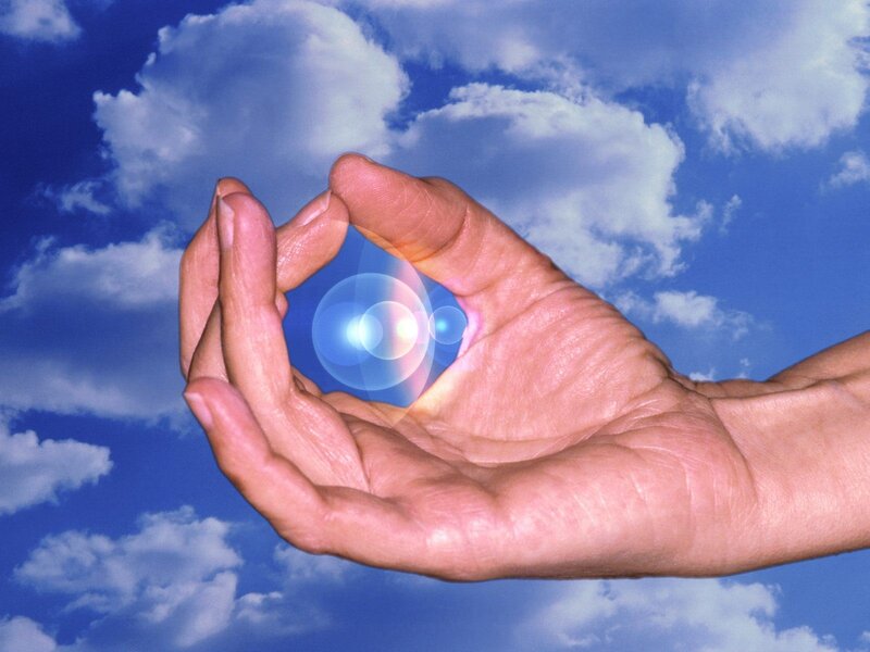 hand holding a glowing orb