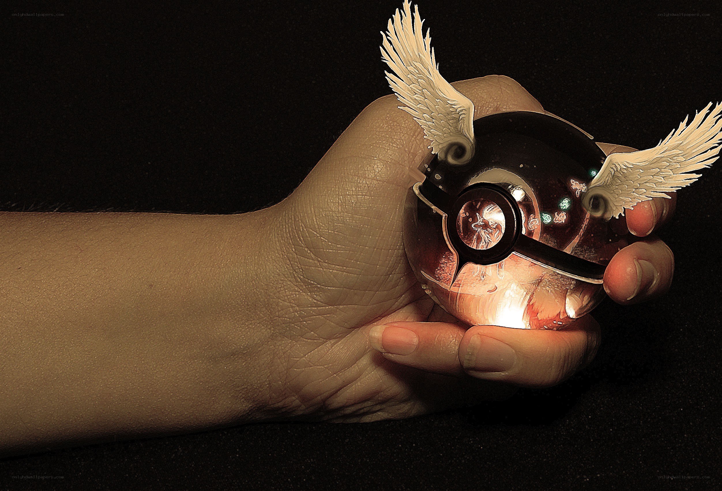 hand holding a glowing pokeball
