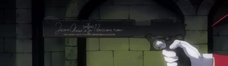 Hand holding a gun with inscription