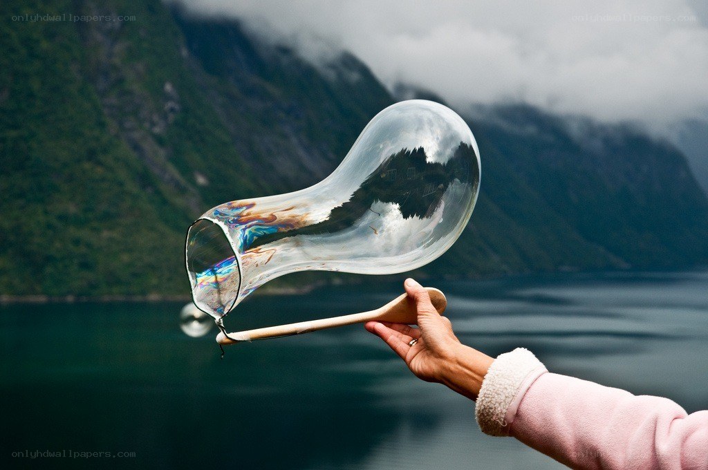 Hand holding a large bubble
