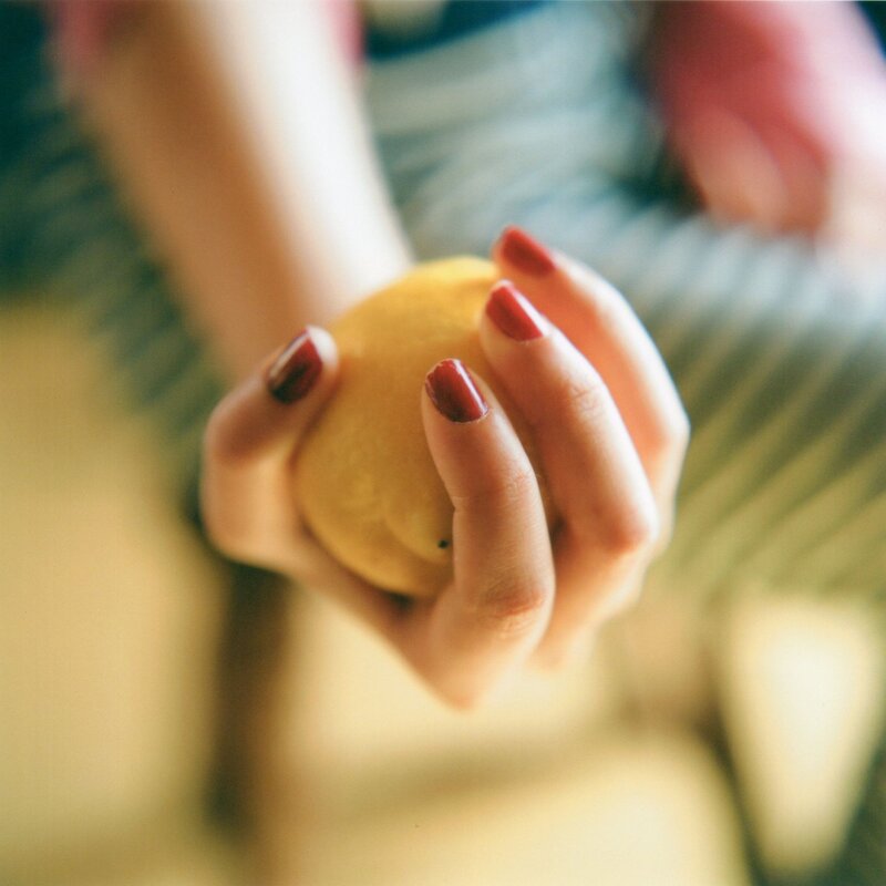 hand holding a lemon