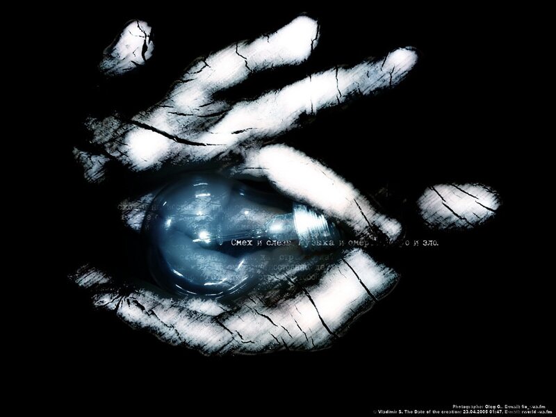 Hand holding a light bulb