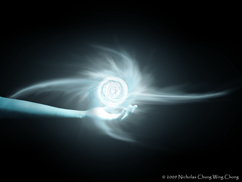 hand holding a light vortex