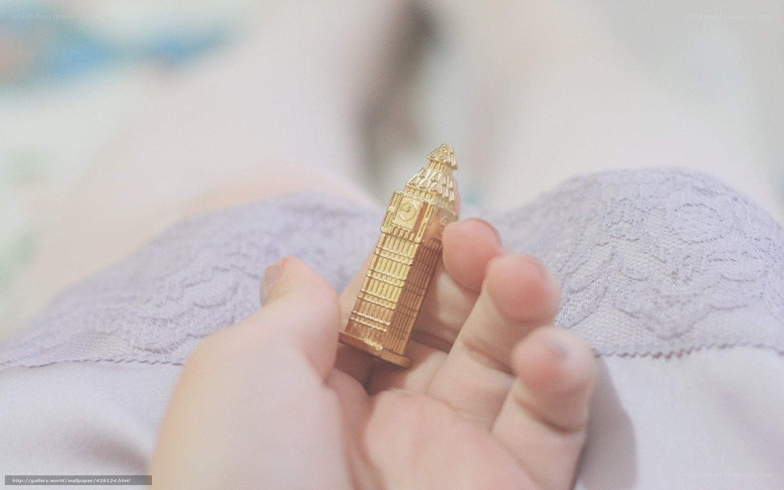 Hand holding a miniature Big Ben