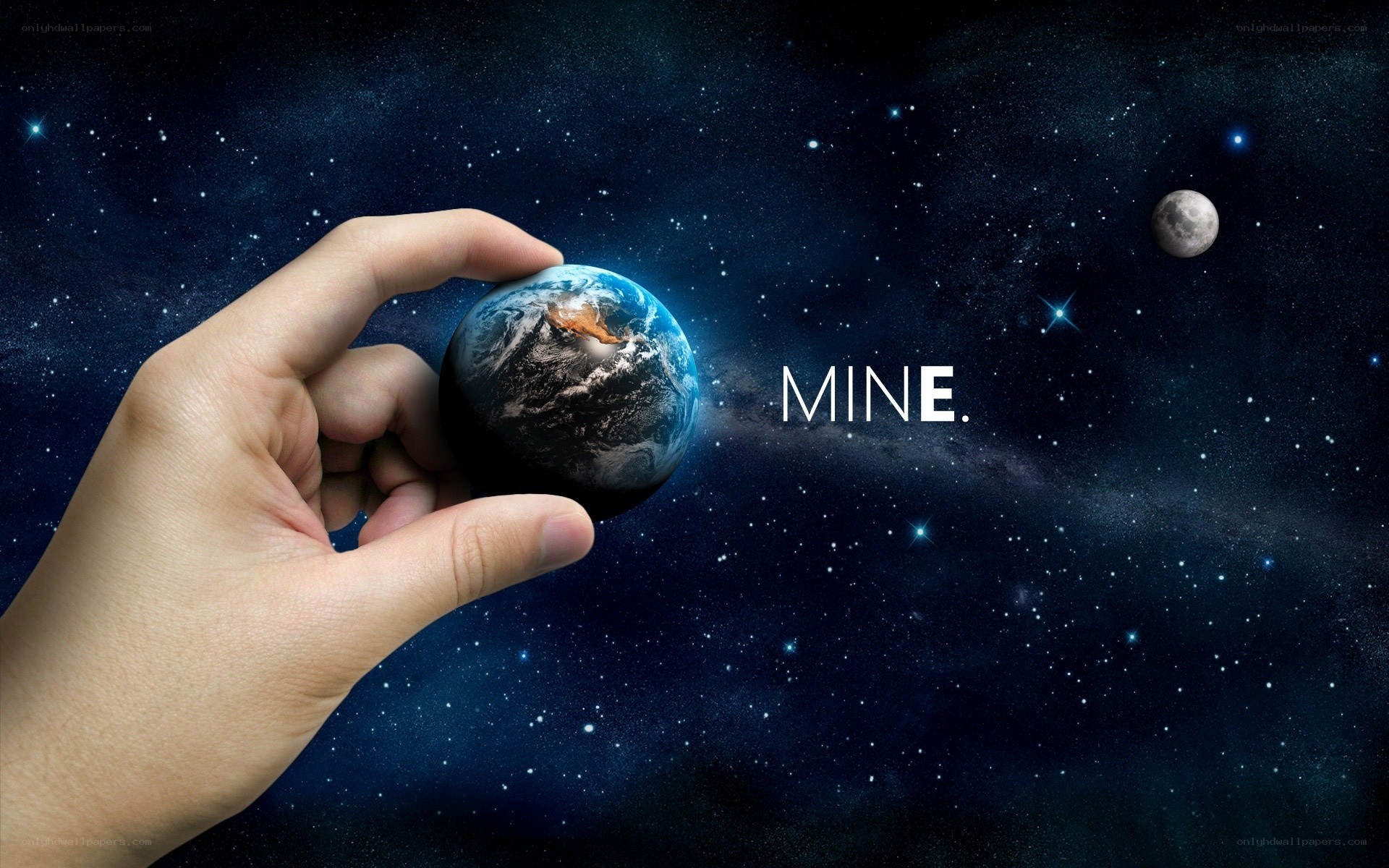 hand holding a miniature Earth