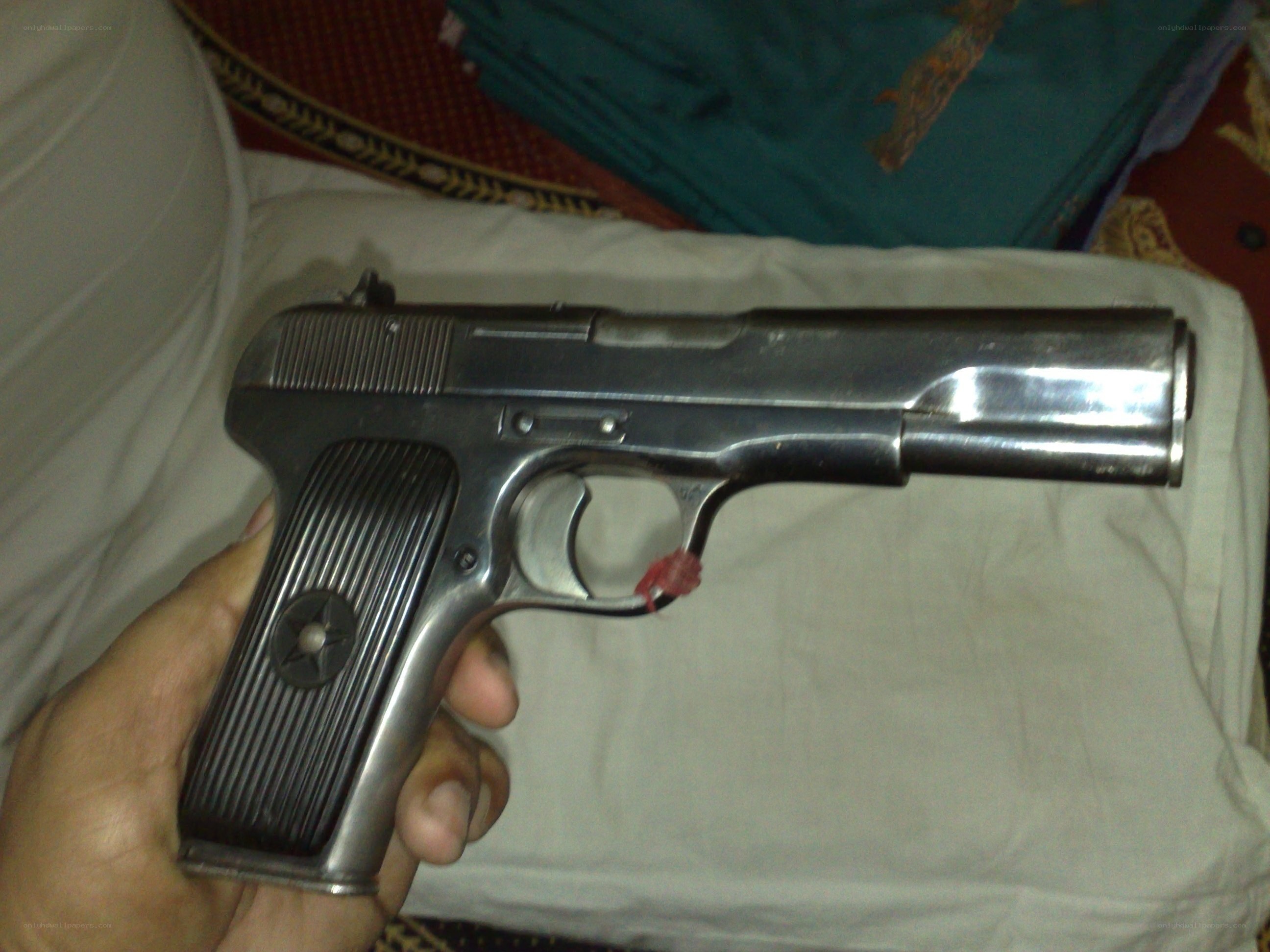 hand holding a pistol