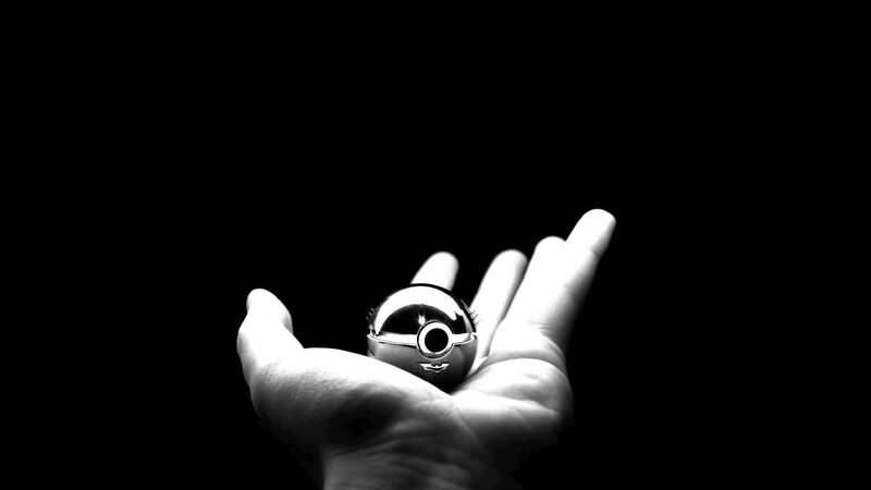 Hand Holding a Pokeball — Black, Dramatic, Photograph
