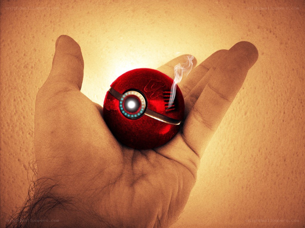 hand holding a red pokeball