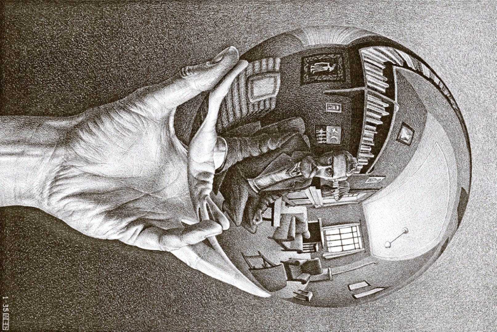 Hand holding a reflective sphere