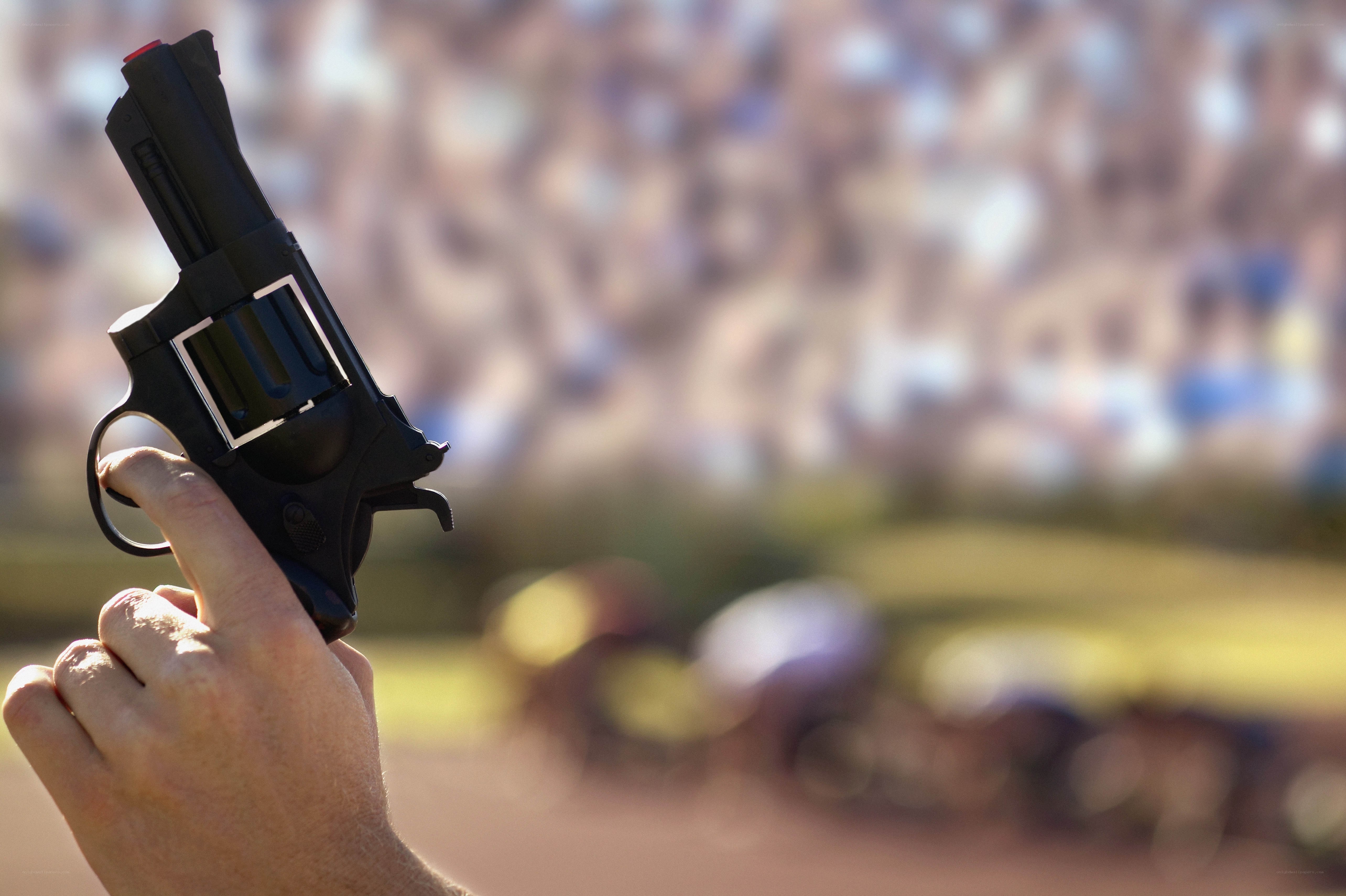hand holding a revolver