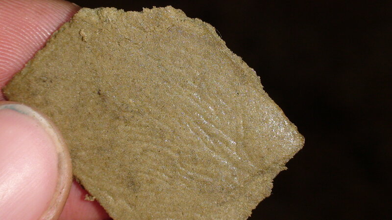 hand holding a rock sample