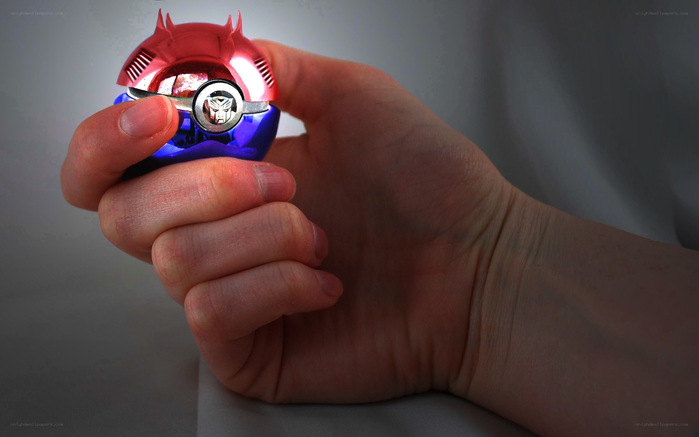 hand holding a transformers toy