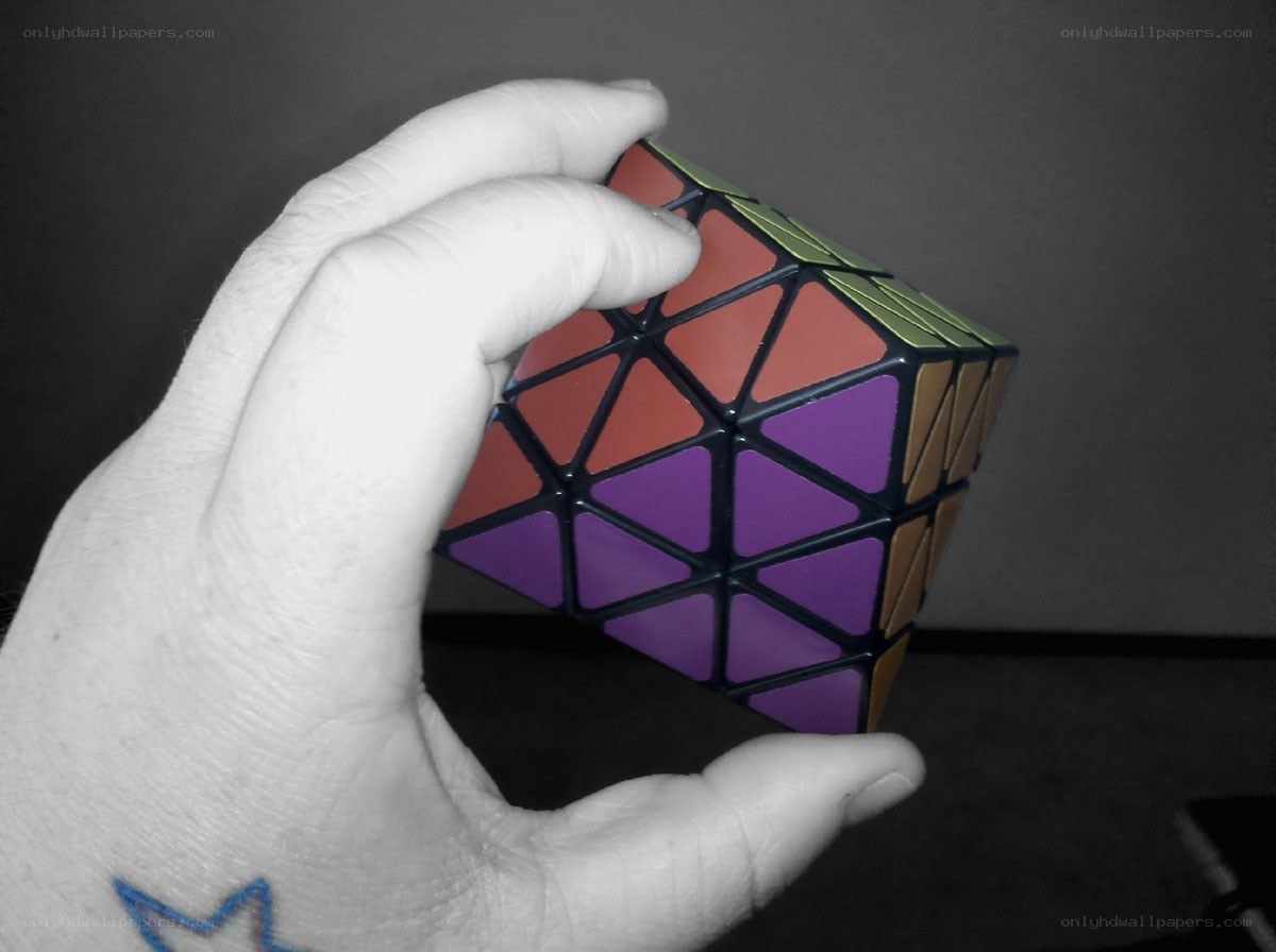 hand holding a twisty puzzle