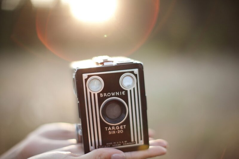 Hand holding a vintage camera
