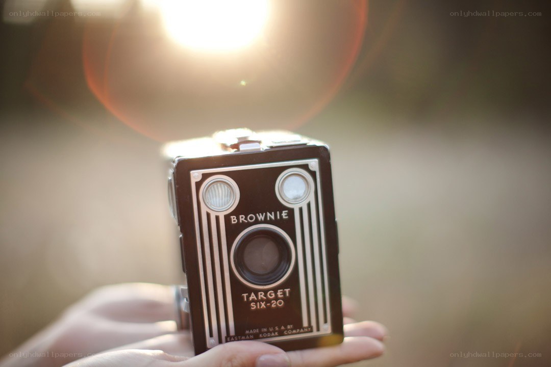 Hand holding a vintage camera