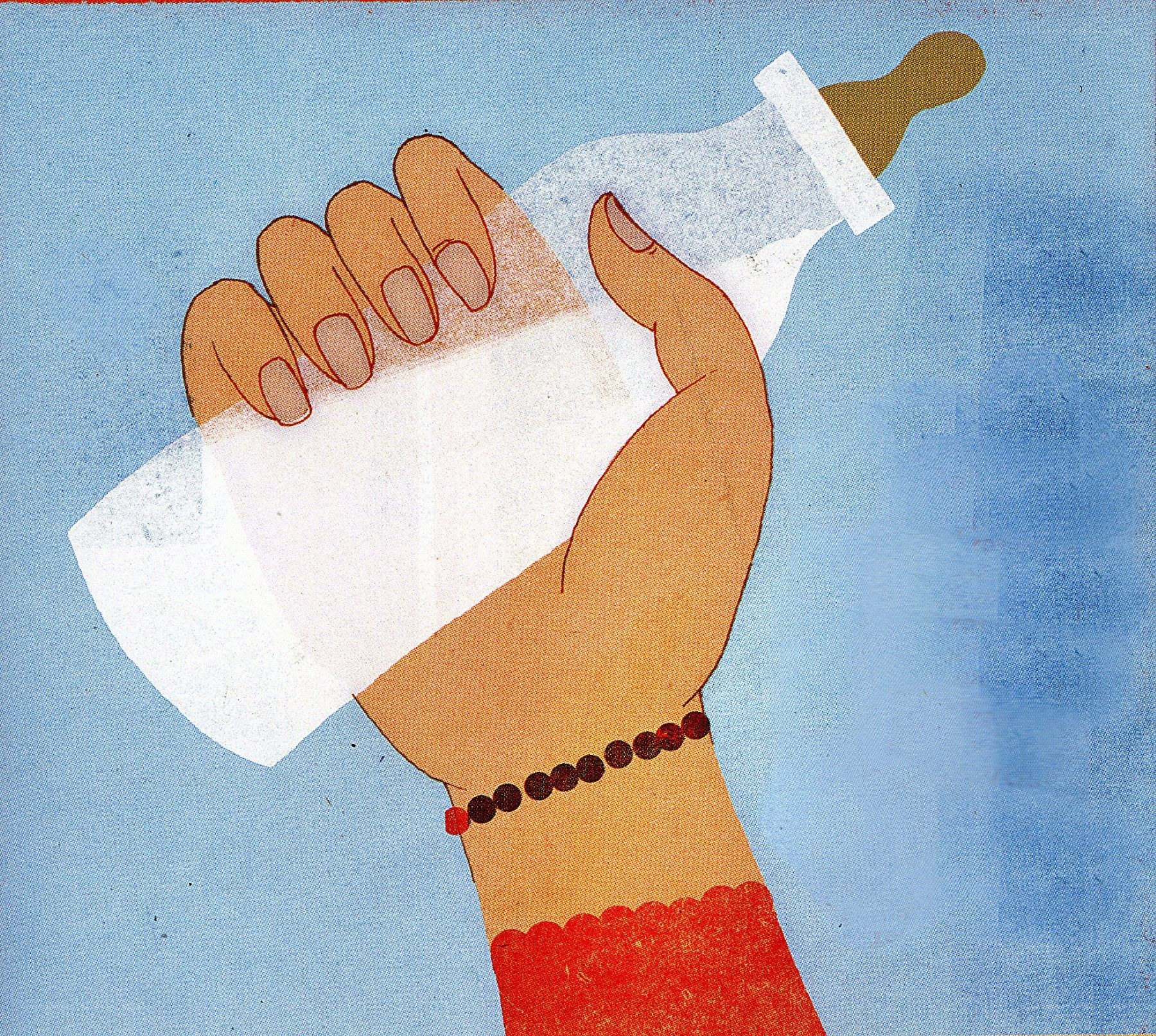 hand holding baby bottle