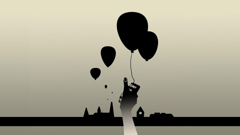 hand holding balloons at dusk