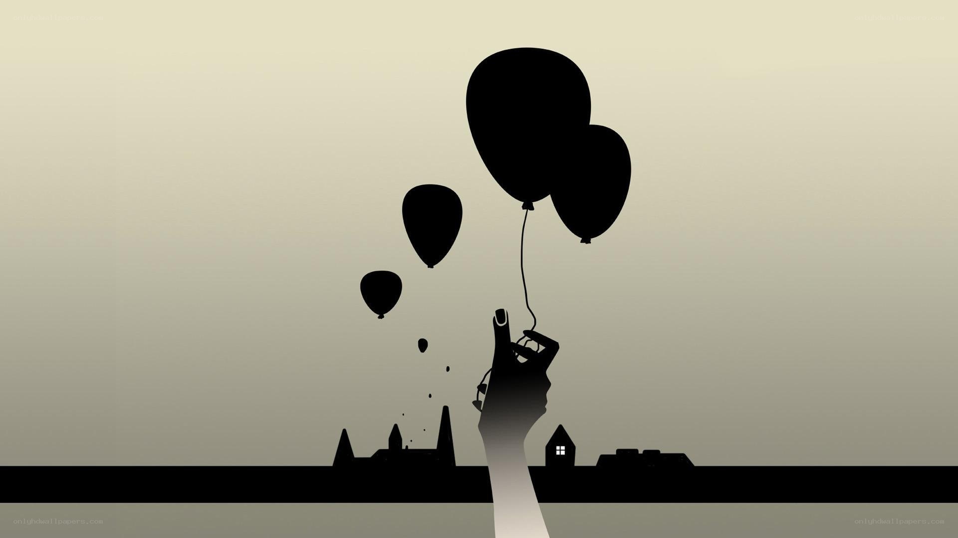 hand holding balloons at dusk