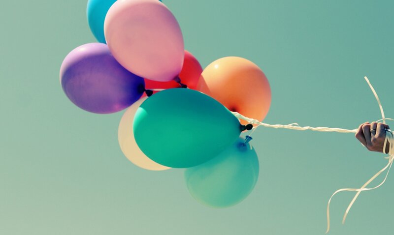Hand Holding Balloons — Teal