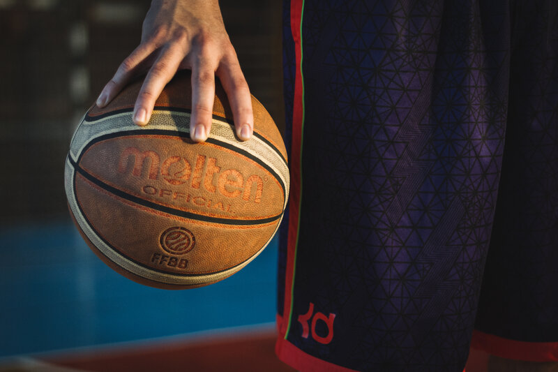 Hand Holding Basketball