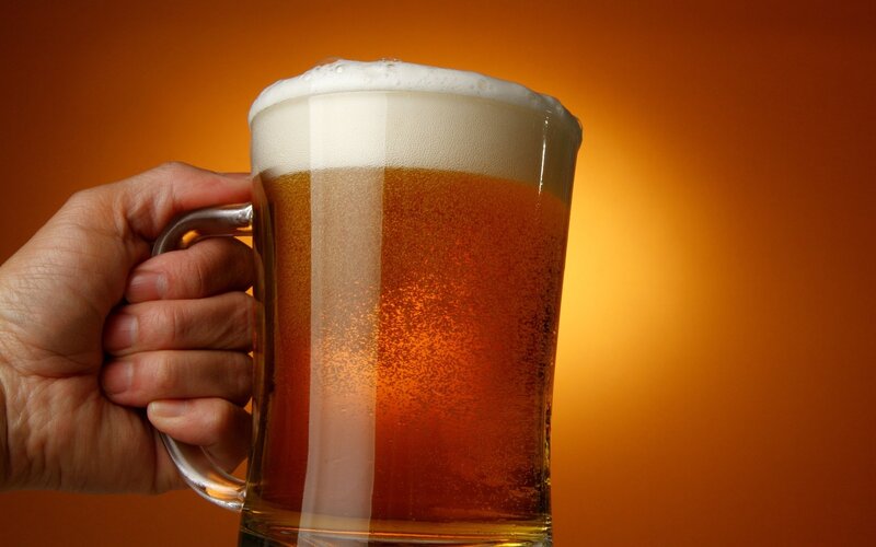 Hand Holding Beer Mug