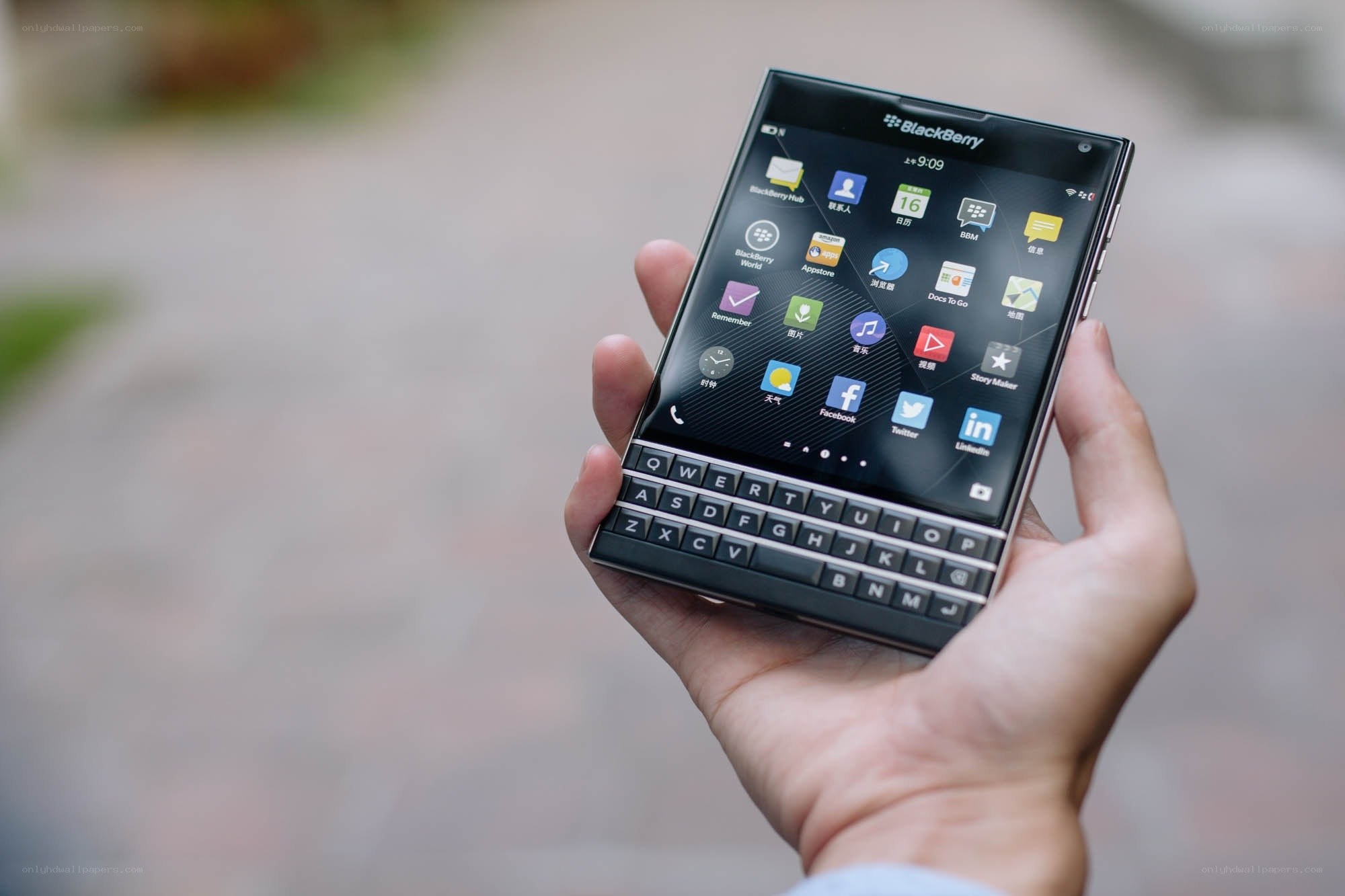 Hand holding BlackBerry smartphone