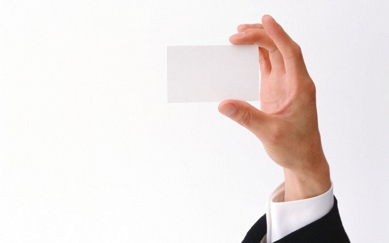 hand holding blank business card