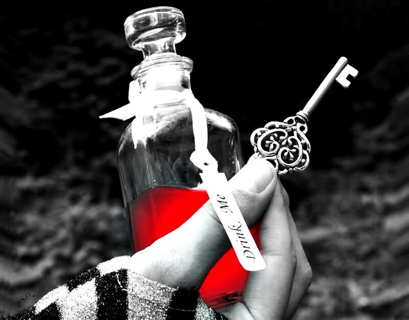 Hand Holding Bottle and Key