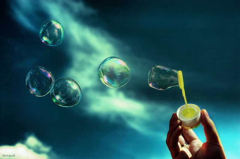 Hand holding bubble wand