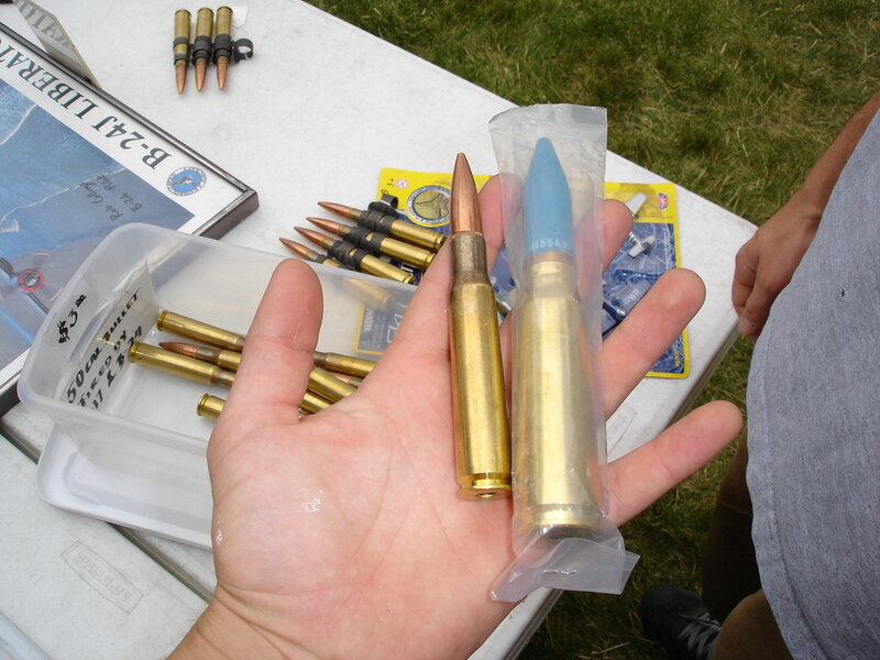 Hand Holding Bullets — Gold