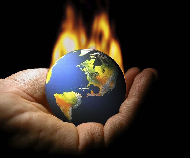 Hand Holding Burning Globe