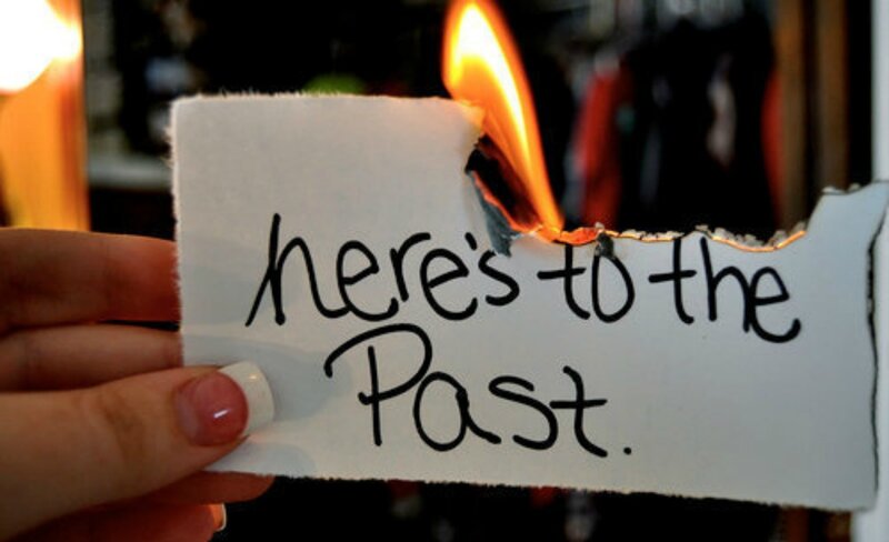Hand Holding Burning Paper