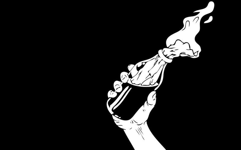 hand holding burning torch