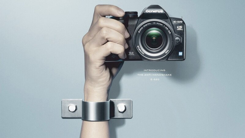 Hand Holding Camera — Gray, Dramatic, Photograph, Wrist Restraint