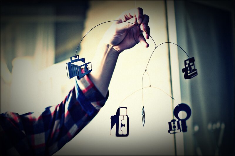 Hand Holding Camera Mobile — Blue