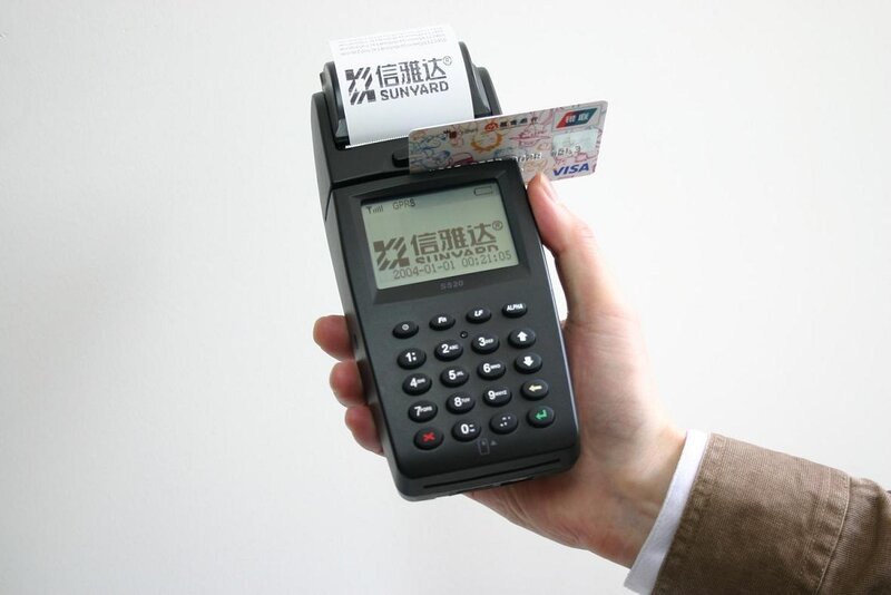 Hand Holding Card Reader