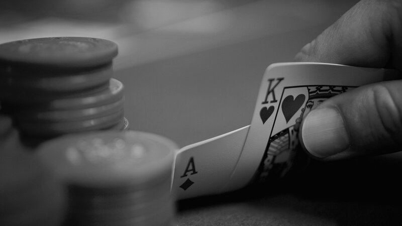 Hand Holding Cards — Black, Dramatic, Photograph